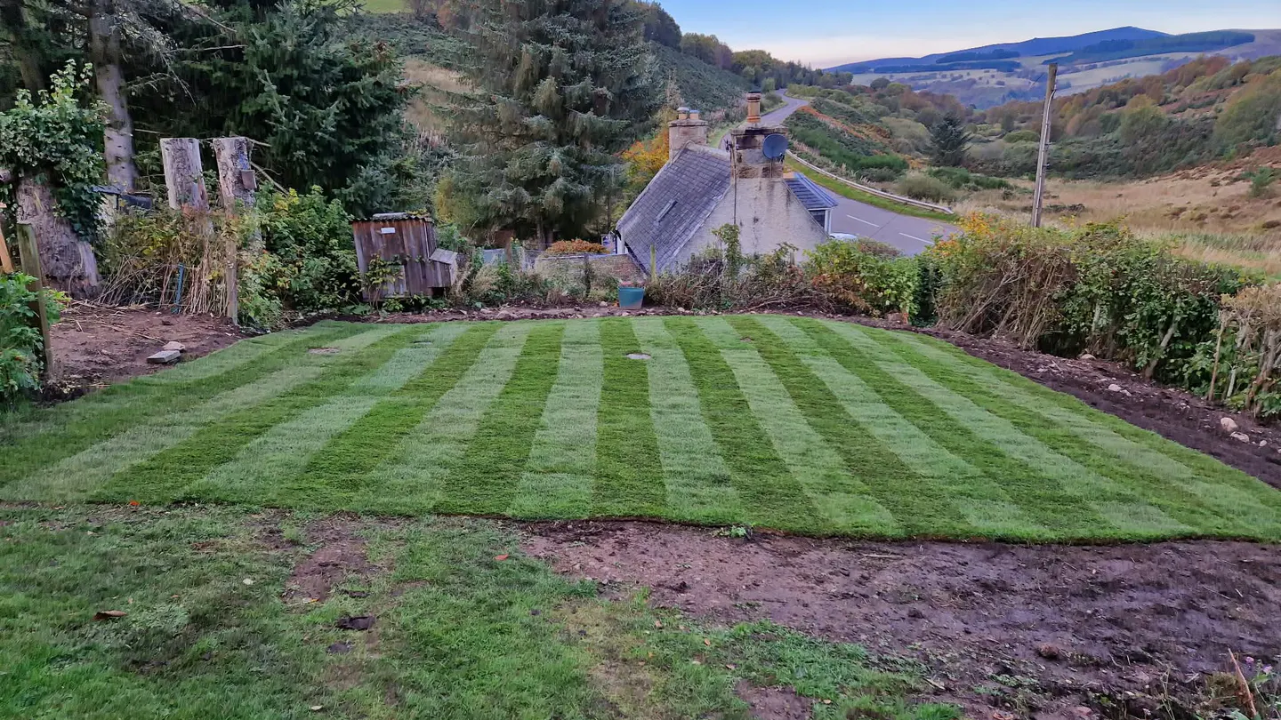 Extensive maintained grounds overlooking a rural valley