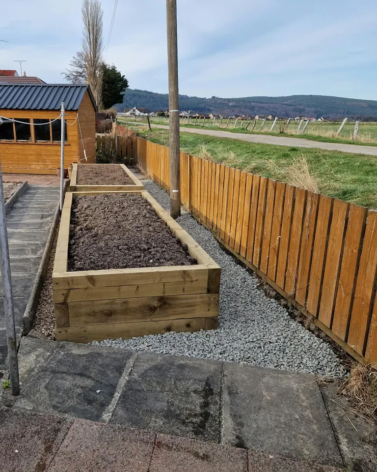 Prepared timber raised beds with clean gravel surrounds